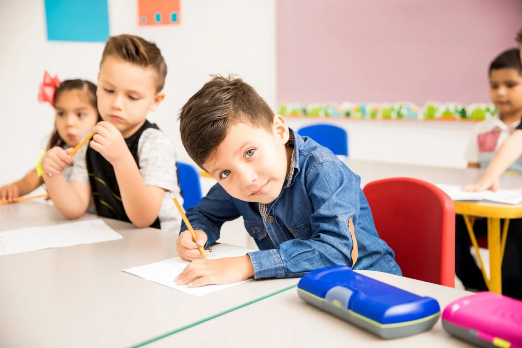 Portrait of a child doing some basic math exercises.