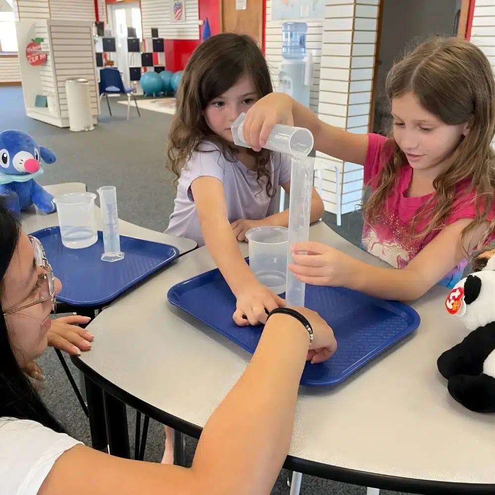 Learning Pod Science Experiment Homeschool Learning Pod science experiment with students and tutor